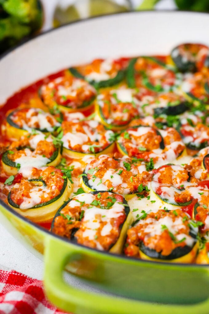 Zucchini lasagna rollups in a cast iron.
