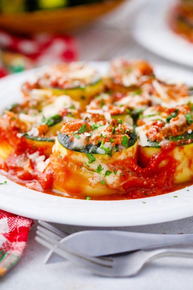 Cheesy zucchini lasagna rollups in marinara sauce.