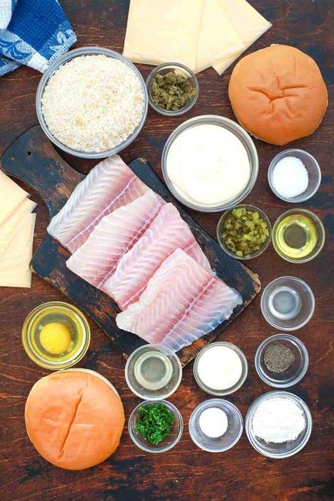 overhead shot of fish fillets panko eggs sauces and spices in bowls on a table
