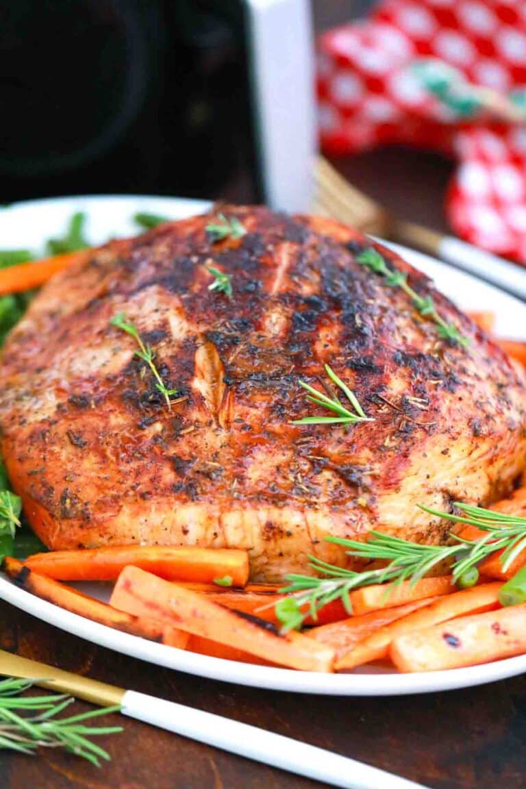 air fried turkey breast on a platter with veggies