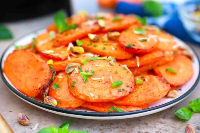 air fryer carrots served with pistachios and fresh basil