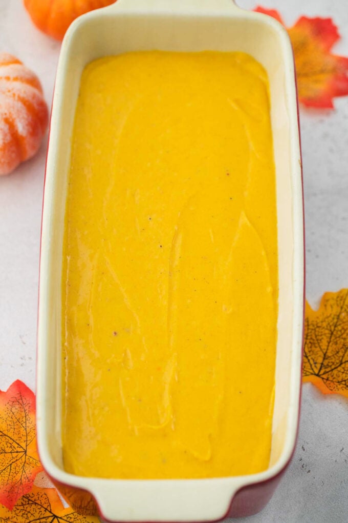 Pumpkin pound cake batter in a loaf pan.