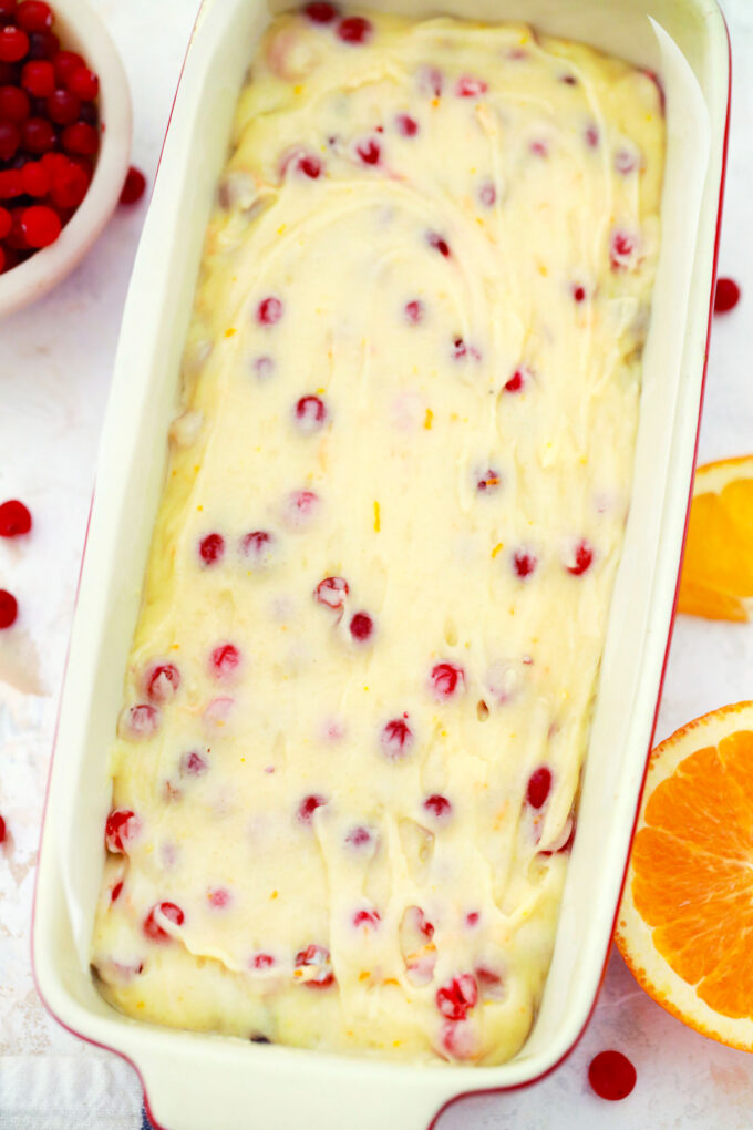 Cranberry orange bread batter in a loaf pan.