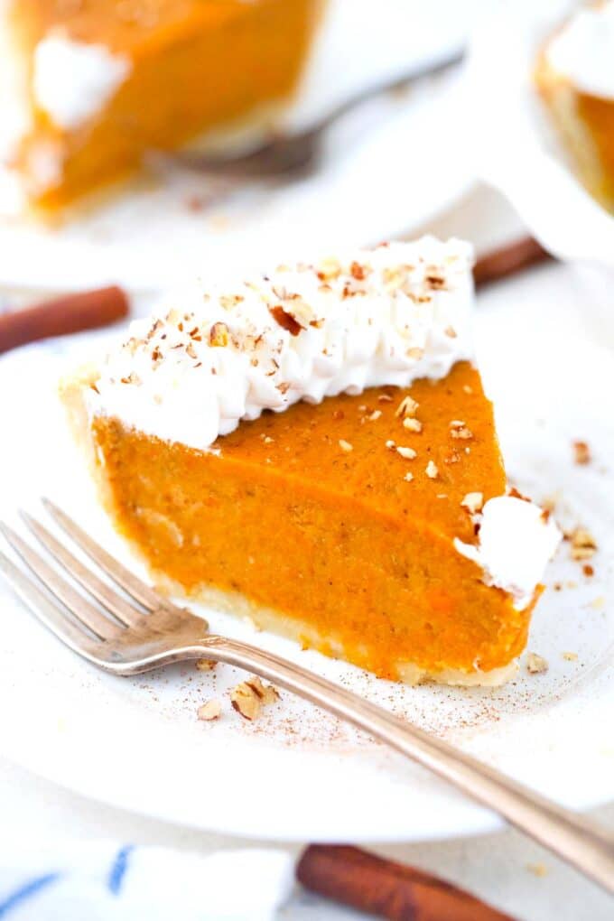 a slice of homemade sweet potato pie with whipped cream