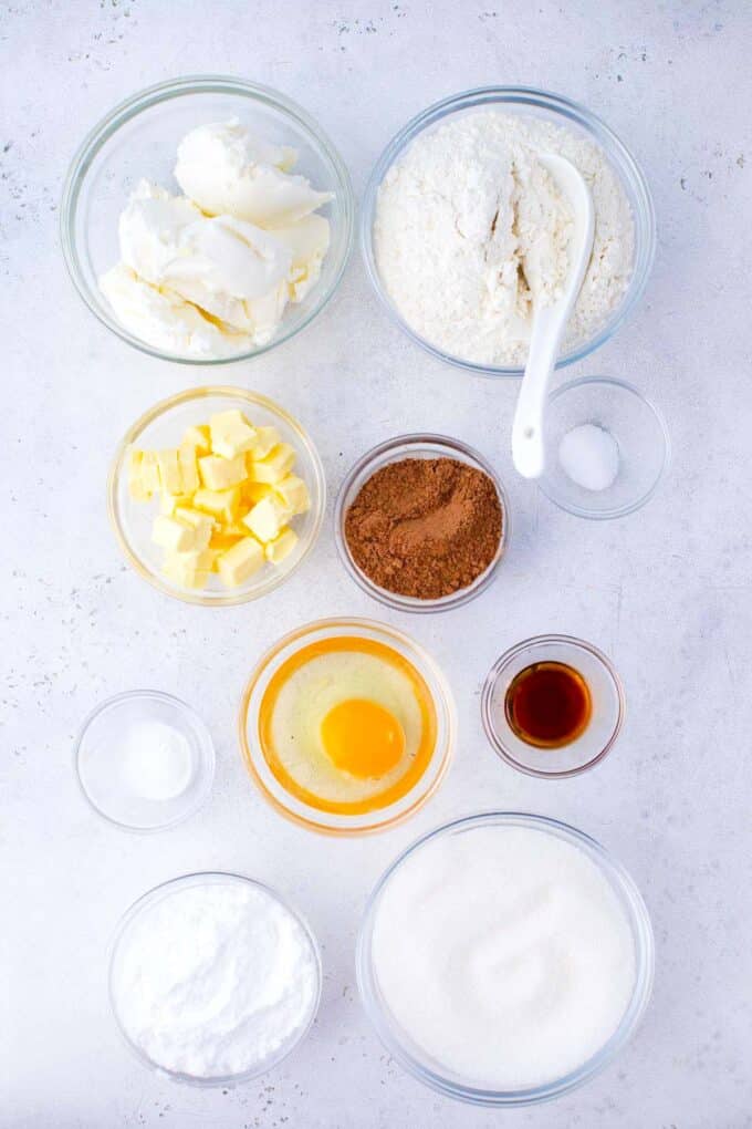 cheesecake stuffed red velvet cookies ingredients in bowls on a table