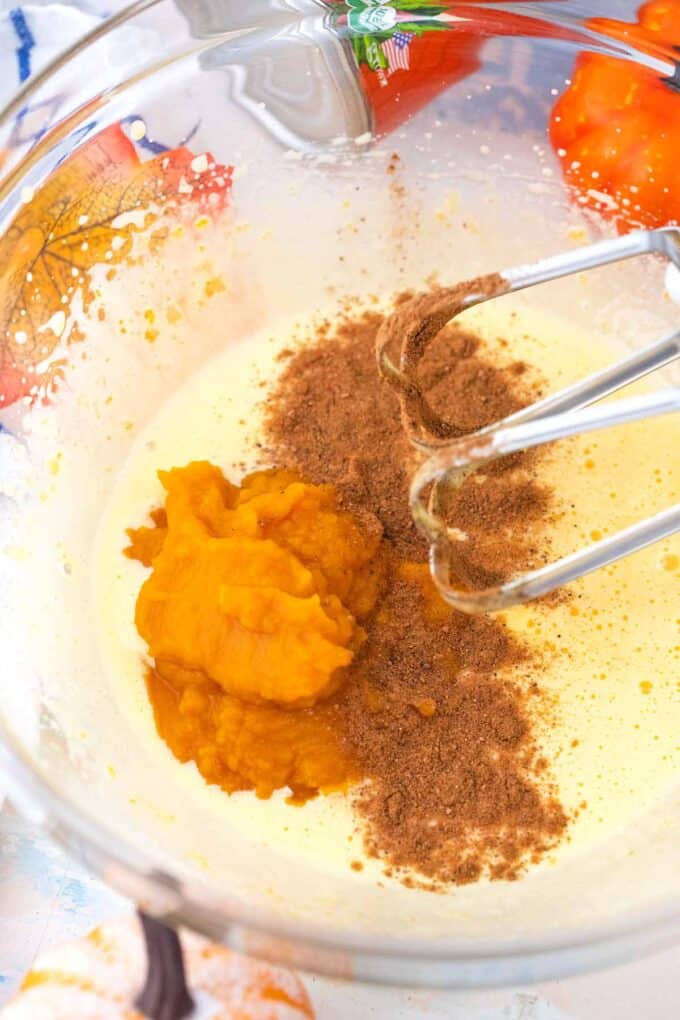 mixing pumpkin puree and spices into the egg mixture