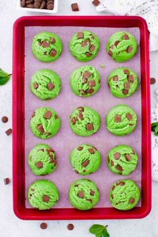 raw pudding mint chocolate chip cookies on a cookie sheet