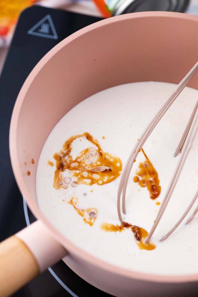 stirring cream and vanilla in a saucepan