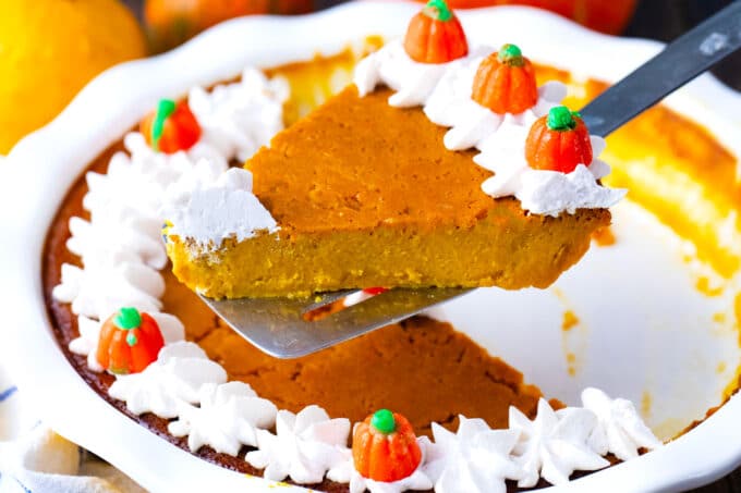 Serving a slice of creamy crustless pumpkin pie.