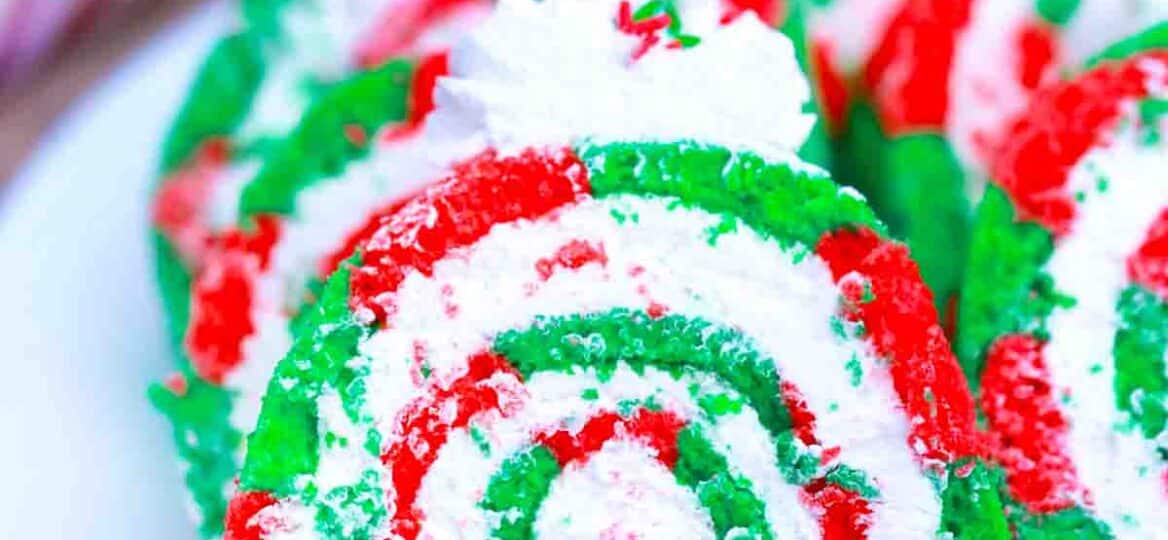 red and green christmas cake roll slices on a plate