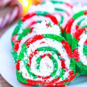 red and green christmas cake roll slices on a plate