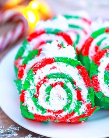 red and green christmas cake roll slices on a plate