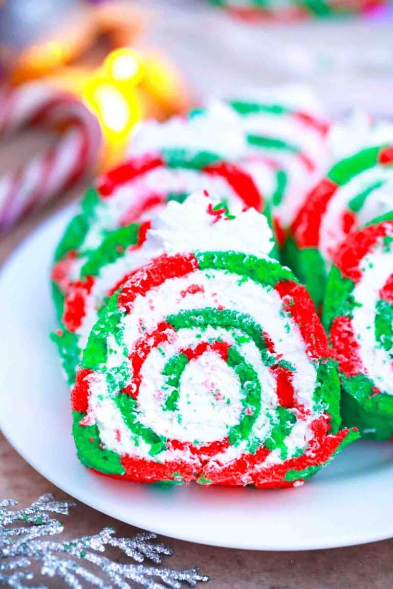 red and green christmas cake roll slices on a plate