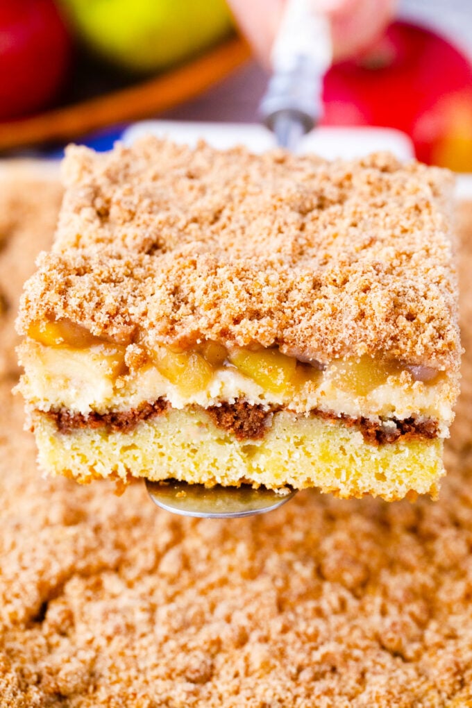 A slice of apple pie coffee cake with apple pie filling.