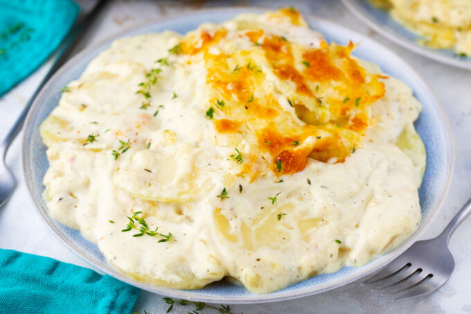 A serving of cheesy bechamel sauce potato gratin.