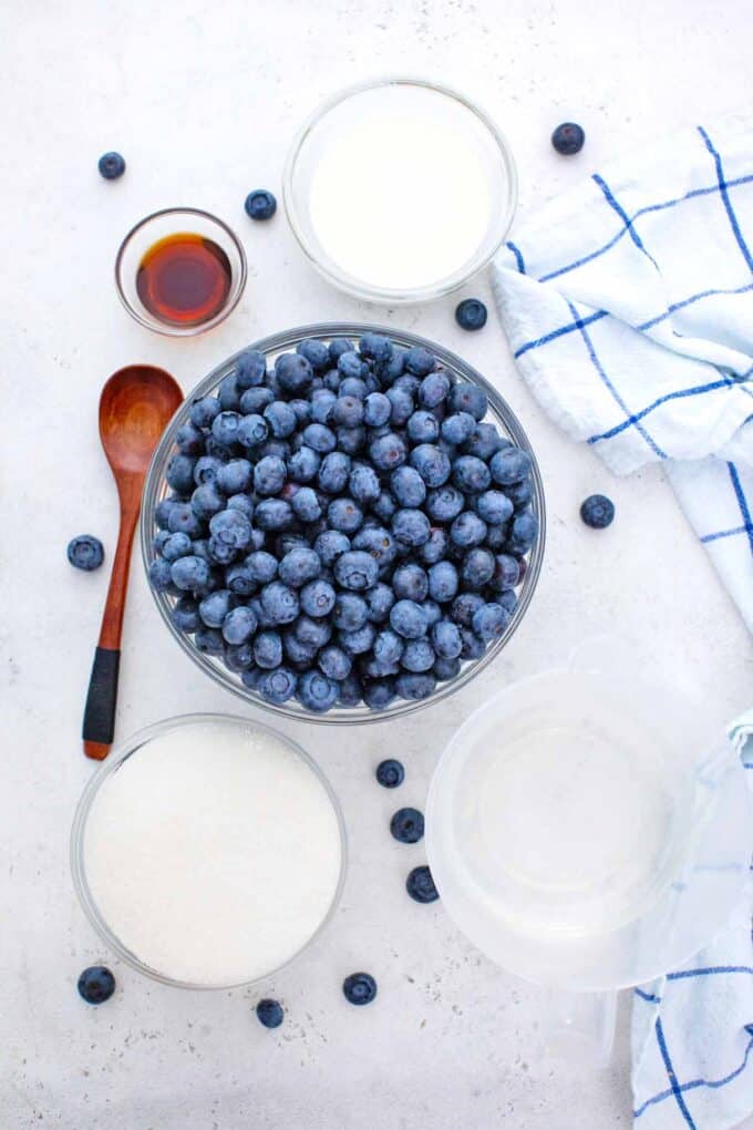 homemade blueberry sauce ingredients in bowls on a table