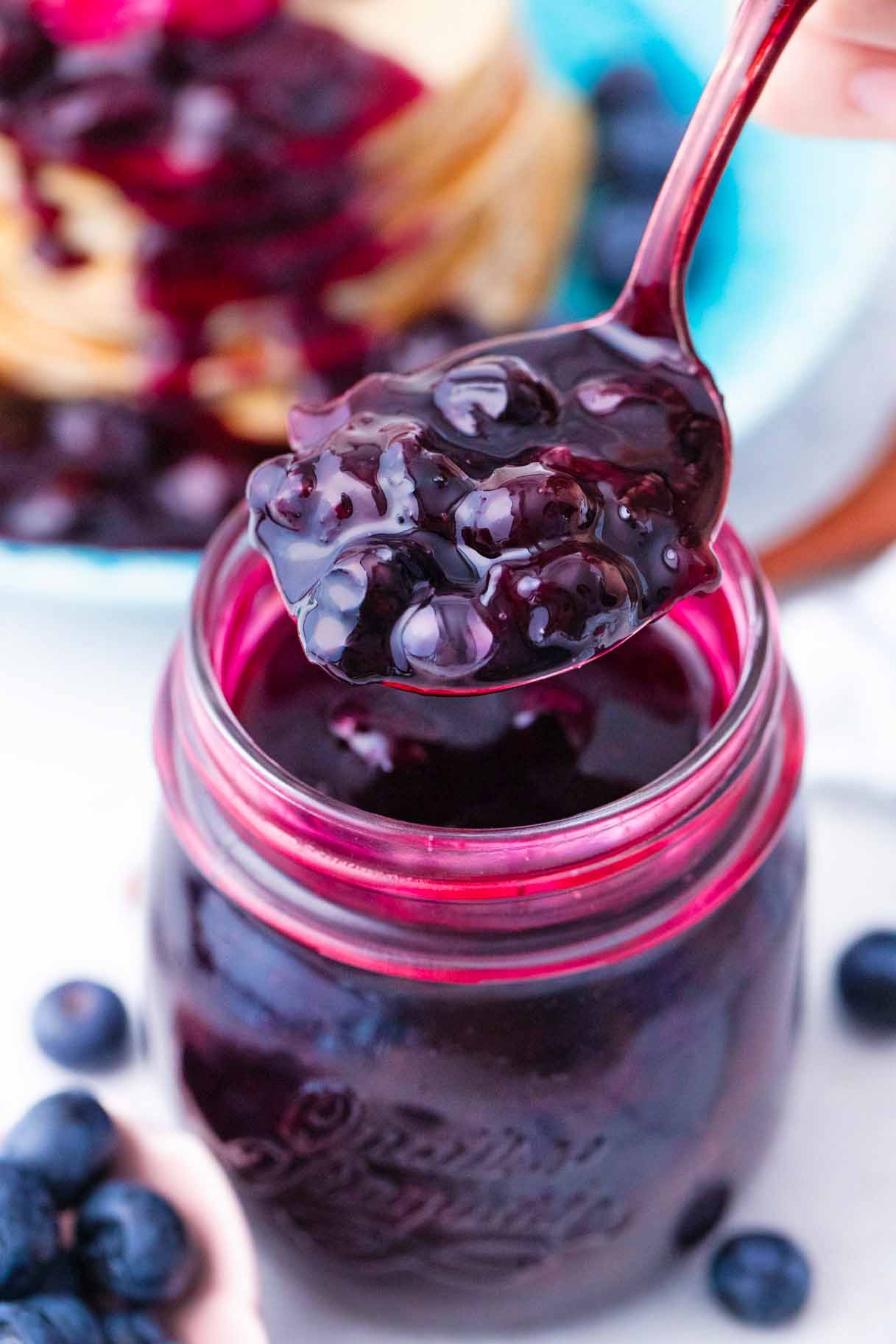 a spoonful of homemade blueberry sauce with juicy, whole blueberries