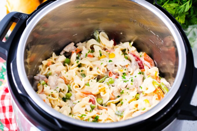 Cheesy instant pot chicken pot pie pasta in the pressure cooker.