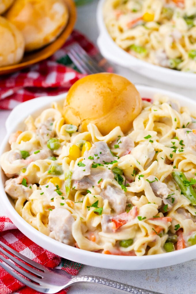 A bowl of cheesy instant pot chicken pot pie pasta.