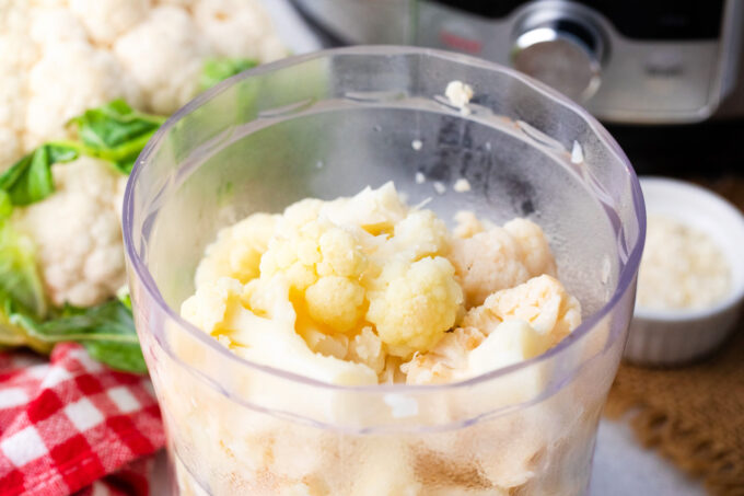 Cooked cauliflower in a food processor.
