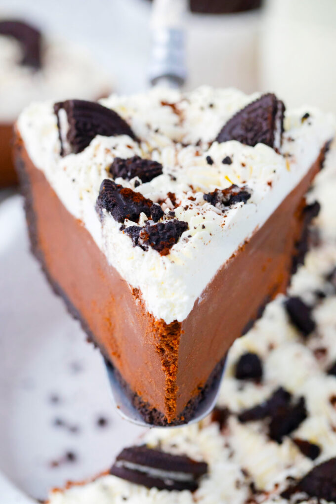 A slice of no bake chocolate pie on a serving spatula.