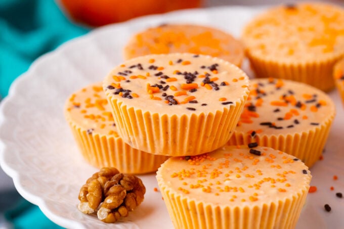 Orange pumpkin fudge on a serving plate.