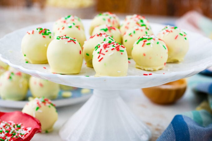 Sugar cookie truffles on a cake stand.