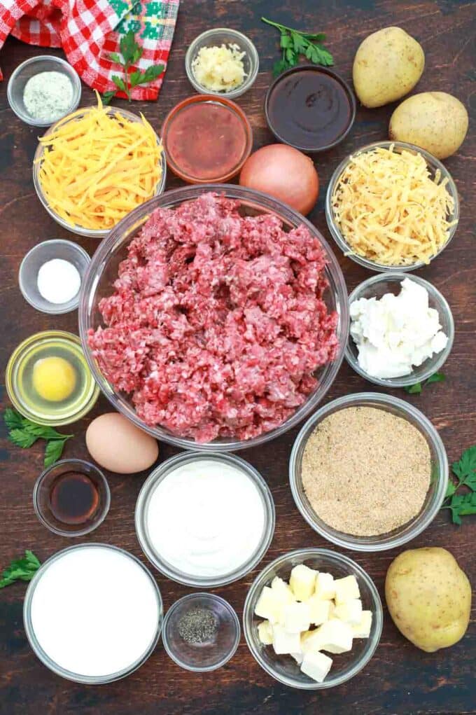 overhead shot of ground beef cheese potatoes spices eggs sauces in bowls