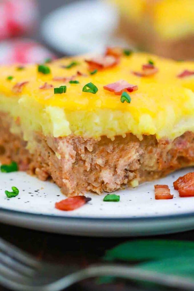 close frontal shot of a slice of potato and meatloaf casserole