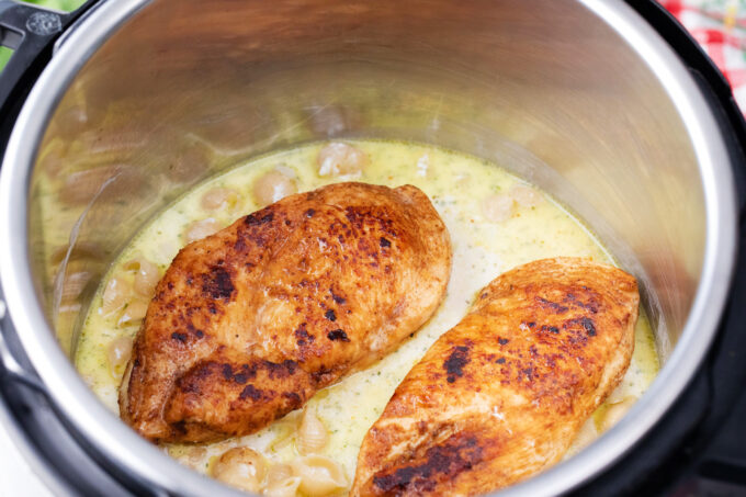 Pressure cooking instant pot chicken bacon ranch pasta.