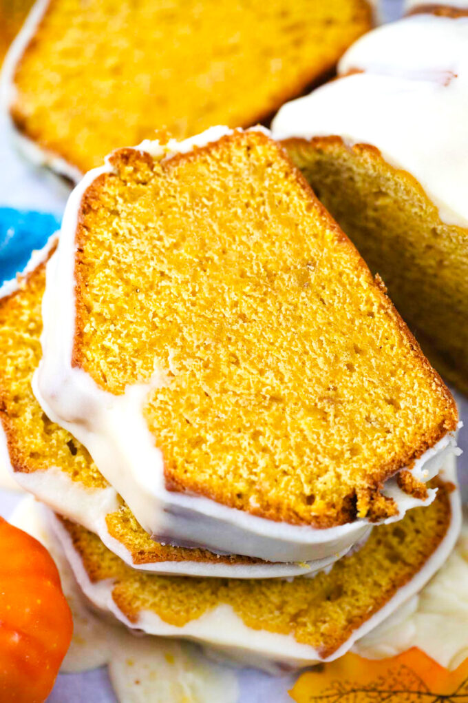 Overhead shot of sliced pumpkin pound cake with white chocolate ganache.