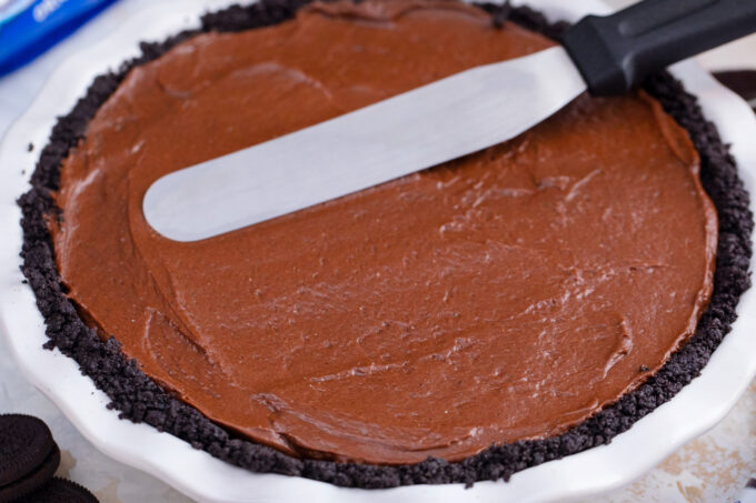 Leveling the top of no bake chocolate pie.