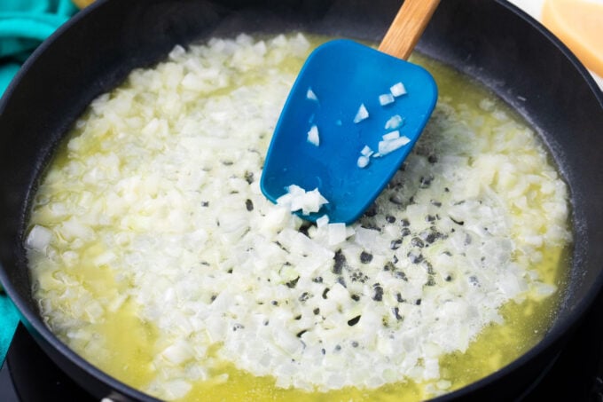 Sauteing onion in a skillet.