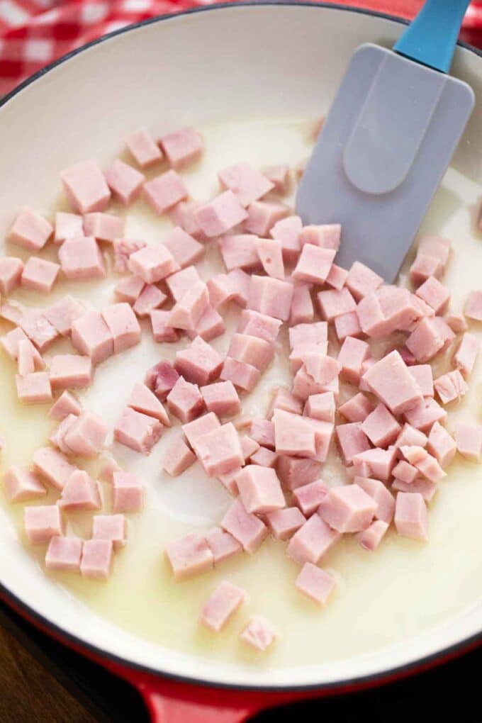 searing diced ham in a pan