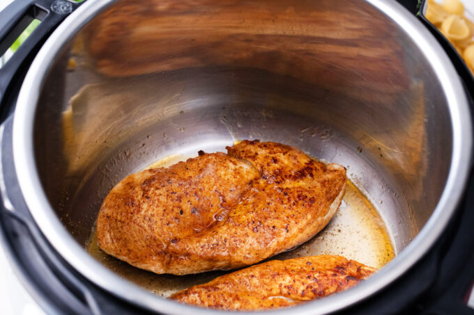 Searing season chicken in the Instant Pot.