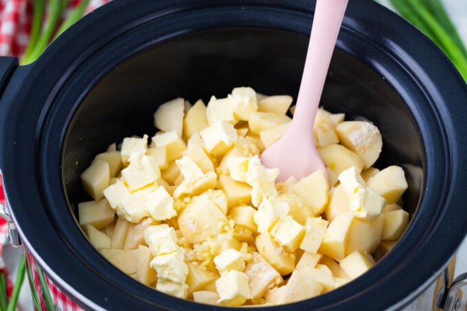 Crockpot mashed potatoes. ingredients in the slow cooker.