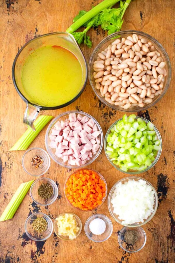 slow cooker ham and bean soup ingredients in bowls on a table