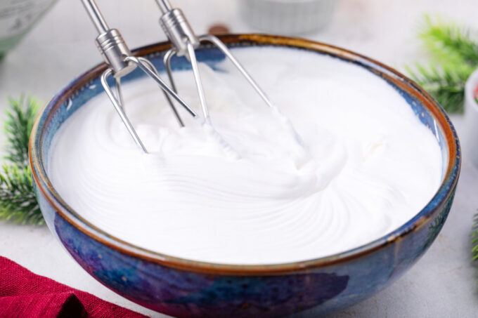 Whipping cream in a bowl.