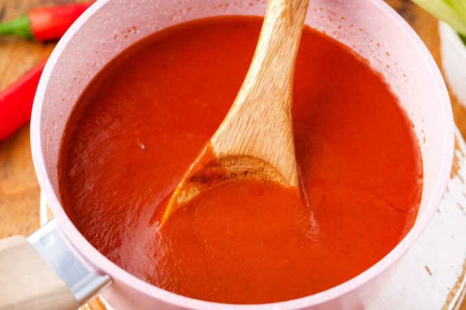 Stirring Buffalo sauce.
