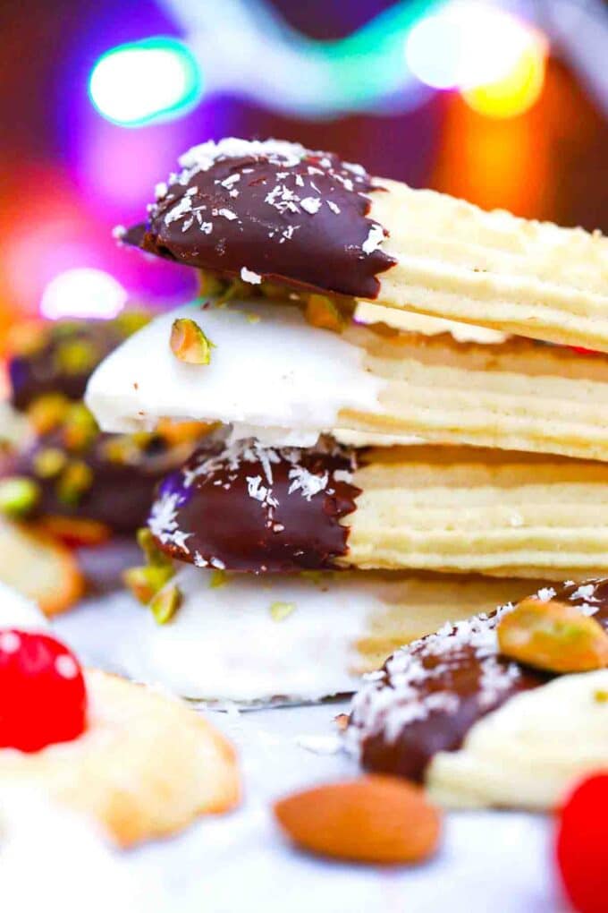 stacked bakery style italian butter cookies dipped in chocolate