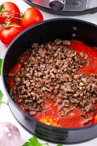 ground beef on top of marinara layer for lasagna