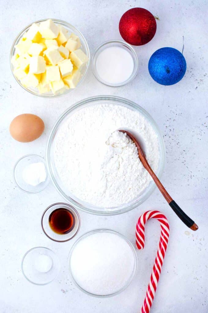 christmas sugar cookies ingredients in bowls on a table