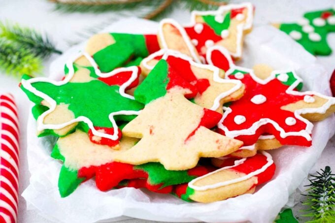 a serving plate with colorful christmas sugar cookies