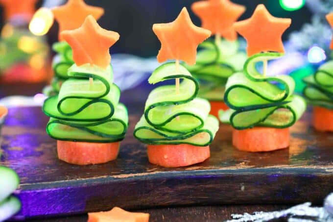 cucumber christmas trees on a wooden board