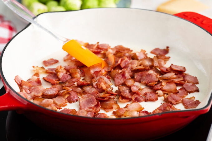 Cooking bacon in a pan.