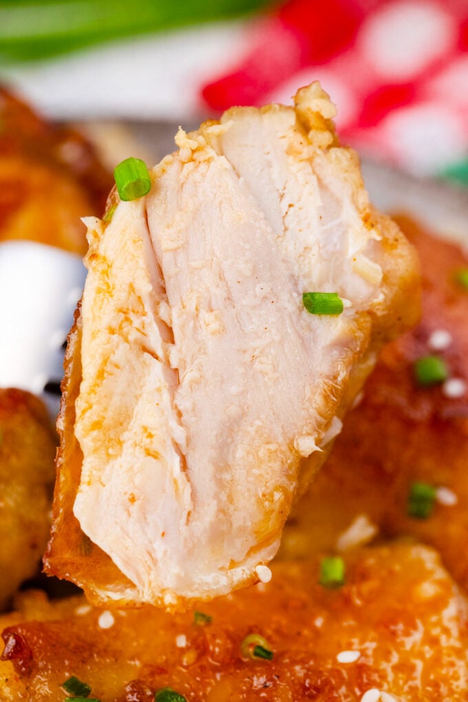 A piece of tender and juicy crockpot brown sugar garlic chicken.