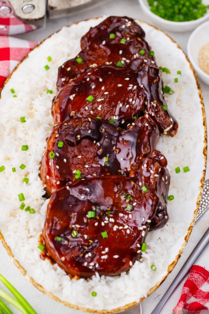 Overhead shot of slow cooker teriyaki pork chops over rice.