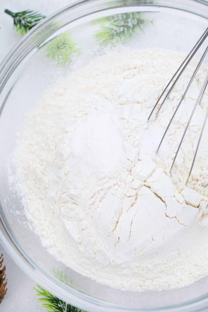 a bowl with dry ingredients and a whisk