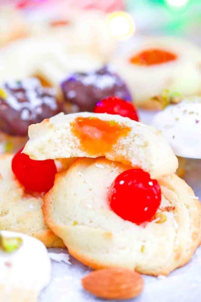 round italian butter cookies with jam and maraschino cherries