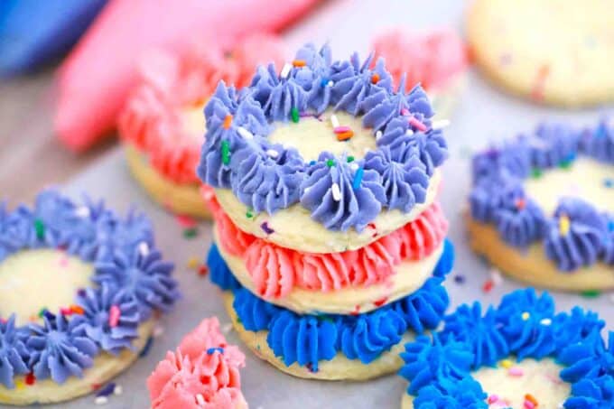 stacked colorful funfetti cookies with frosting